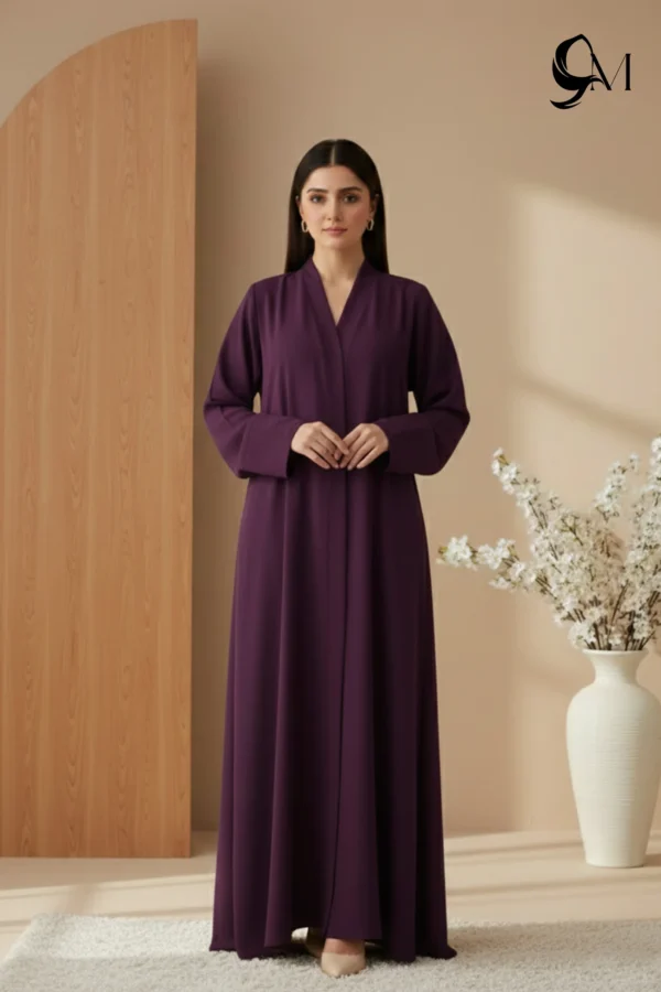 Soft Contrast Framing: Pair with a lavender, dusty rose, or cream hijab to brighten the model's face and elegantly highlight the rich purple tones of the garment. Luminous Accents: Use silver or pearl jewelry and nude pointed-toe heels to create a polished, sophisticated finish that balances the depth of the eggplant shade.