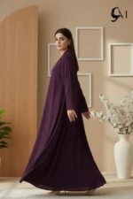 Soft Contrast Framing: Pair with a lavender, dusty rose, or cream hijab to brighten the model's face and elegantly highlight the rich purple tones of the garment. Luminous Accents: Use silver or pearl jewelry and nude pointed-toe heels to create a polished, sophisticated finish that balances the depth of the eggplant shade.
