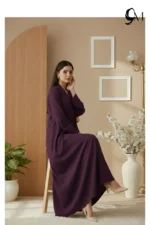 Soft Contrast Framing: Pair with a lavender, dusty rose, or cream hijab to brighten the model's face and elegantly highlight the rich purple tones of the garment. Luminous Accents: Use silver or pearl jewelry and nude pointed-toe heels to create a polished, sophisticated finish that balances the depth of the eggplant shade.